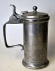 Pewter mug with 
lid and handle, 
18th/19th 
century.  
Germany. 
Stamped at the 
bottom. Height: 
17.5 ...