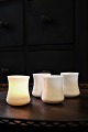Old 
candlesticks in 
white opal 
glass for 
tealights. 
H: 7cm. 
Diameter: 6 cm. 
(1 pieces 
available.)