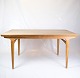The oak dining 
table, designed 
by Johannes 
Andersen, 
represents the 
excellent 
quality and ...