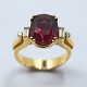 A 18k gold ring 
set with a 
rhodolite and 
diamonds. 
Wesselton - 
VVS.
Ring size 54. 
Please ...