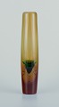 Scandinavian 
glass artist, 
tall and slim 
art glass vase.
Mouth-blown. 
Heavy vase.
Amber and ...