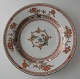 Chinese plate 
in 
porcelain,19th 
century. Family 
rose. Dia.: 23 
cm. Mended.