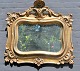 Danish 
neo-rococo 
gilded mirror, 
19th century. 
Frame with 
rocaille and 
tang. H: 65 cm. 
W: 70 cm.