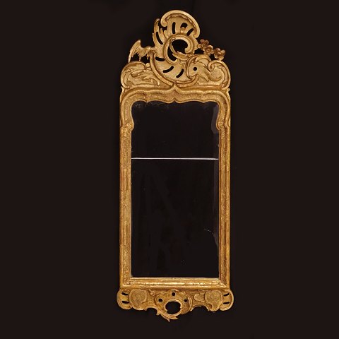 A gilt Danish Rococo mirror. Denmark circa 
1750-60. H: 99cm. W. 38cm