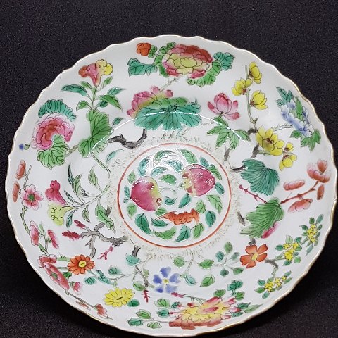 Chinese porcelain plate with scalloped edge.