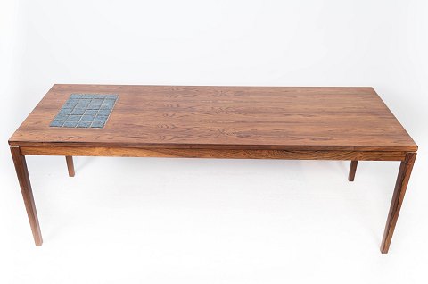 Coffee table in rosewood with blue tiles of Danish design from the 1960s.
5000m2 showroom.