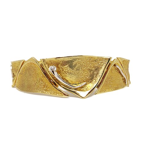 Ole Lynggaard; Bracelet in 14 gold with white gold and a brillant
