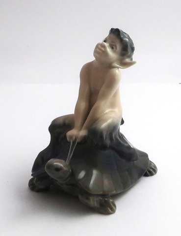 Royal Copenhagen. Porcelain figure. Faun sitting on turtle. Model 858. Height 9 
cm. (1 quality)