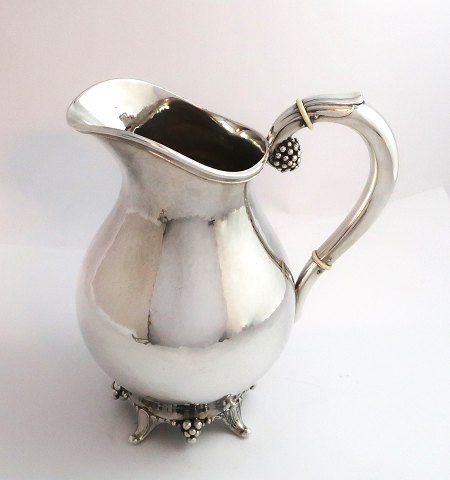 Svend Toxvärd. Sterling silver pitcher with grapes, hammered. Height 18 cm.