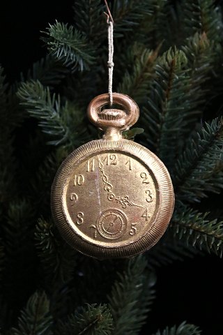 Antique Dresden Christmas ornament from 1900 in the shape of a pocket watch in 
gold painted papier-mâché.