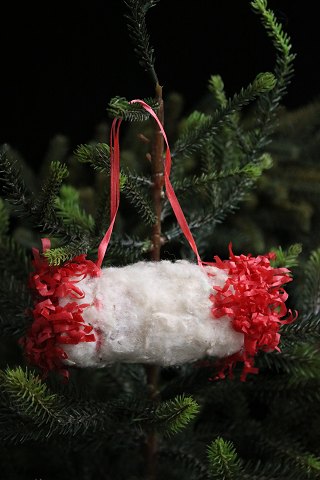 Antique Christmas tree ornament from around 1920-30 in the shape of a muff made 
of cotton wool and tissue paper.