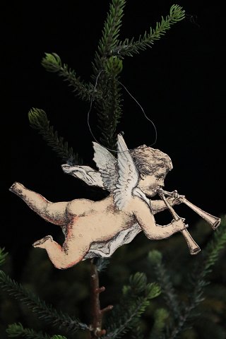 Old Christmas tree ornament from the 30s/40s in the shape of a cardboard angel.