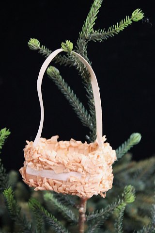 Antique Christmas tree ornament from around 1920 in the shape of a Christmas 
basket made of cardboard and tissue paper.