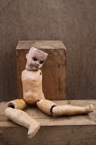 Old 19th century doll, head with glass eyes, body and legs in painted 
papier-mâché ... Old 19th century doll, head with glass eyes, body and legs in painted 
papier-mâché ...