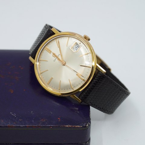 Omega; Wristwatch in steel with gold, 1965