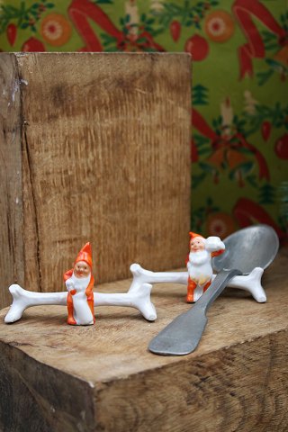 Old Swedish Christmas knife stool in porcelain with a little elf sitting on a 
tree trunk to put his cutlery on.