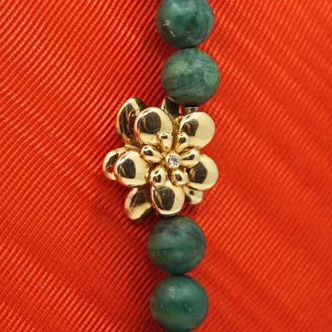 Ole Lynggaard, Charlotte Lynggaard; Clasp of 18k gold, set with a diamond