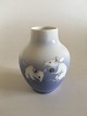 Royal 
Copenhagen Art 
Nouveau Vase 
with two rats. 
Marked with 
70/45a and 
measures 10cm 
high and ...