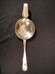 Dobbeltriflet 
Cohr.
 Silver tea 
strainer 13 L. 
equivalent to 
sterling 
silver.
 Contact for 
price
