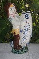 Aluminia 
faience. Child 
welfare 
figurine, boy 
with fish, from 
1946. no. 2439. 
Height 13 cms. 
...