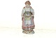 Meissen 
figurine, Woman 
holding a 
basket full of 
flowers.
Decoration 
number ...