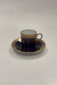 Rosenthal Mocha 
Cup in blue and 
gold. Gold 
decoration 
inside. Cup 
measures 5 cm 
high and 4.5 cm 
dia.