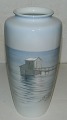 Tall vase in 
porcelain from 
Bing & Grondahl 
with coastal 
scene. 
Decorated by 
Margrethe 
Hyldahl ...