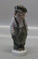 Dahl Jensen 
1040 Paper boy 
with cap (DJ) 
20 cm Marked 
with the Royal 
Crown and DJ 
Copenhagen. In 
...