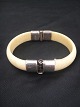 Ivory Bangle.
Silver: 830 s 
Inner Diameter: 
6.5 x 4.5 cm.
Thickness: 1.2 
cmkan open on 
one ...