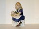 Bing & Grondahl 
dog figurine, 
girl holding 
flowers.
The factory 
mark tells, 
that this was 
...