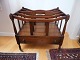 Reproduced 
canterburry in 
mahogany on 
wheels and with 
drawer, England 
approx. 1940.
42cm. high, 
...