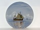 Royal 
Copenhagen 
large plate, 
ships on ocean.
The factory 
mark tells, 
that this was 
produced ...
