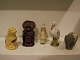 5 figur 
sparebøsser i 
terrakotta. 1) 
Fra venstre: 
Hund i glaseret 
keramik fra 
Bornholm sidst 
i ...