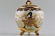 Satsuma 
earthenware jar 
with lid. 
Decorated with 
two women in 
profile. 
Measures: 20 x 
15 cm. ...