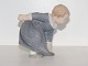 Bing & Grondahl 
figurine, girl 
bending down.
The factory 
mark tells, 
that this was 
produced ...
