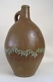 Pitcher in 
pottery, 4, 
Germany, 
painted, 19th 
century.
 Decorated with 
leaves. H: 45 
cm.