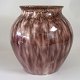Danish clay 
vase. 
White clay 
coating with 
brown 
overglaze, 
ca.1920. H: 21 
cm. Remains of 
stamps ...