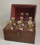 Decanter box, 
England, 19th 
c. Mahogany, 
with 6 original 
decanters with 
stoppers with 
gold ...