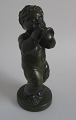 Hjort figure of 
trumpet-playing 
cherub, green 
glazed clay, 
20th century. 
Denmark. H .: 
22 cm. No ...