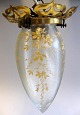 Ceiling 
lighting, 
approx.1900. 
With wreath in 
brass. Lamp in 
crystal with 
enamel 
paintings of 
...