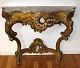 Nyrococo mirror 
console with 
marble top. 
19th century. 
Giltwood - 
later bronzed. 
Plate in brown 
...