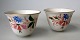 Pair, russian 
vodka cups of 
porcelain, 
about 1930. 
Scattered&nbsp;flowers 
on white 
porcelain ...