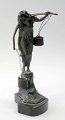 Art Nouveau figure in patinated bronze, approx. 1900. In the form of a woman with a ...