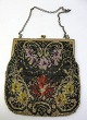 Women bag, 
1930, glass 
bead work. With 
handle in 
brass. 
Decoration in 
the form of 
flowers. ...