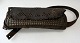 Cartridge belt 
in leather, 
Mongolia, c. 
1900. With 
rivets in 
brass. To 8 
cartridges. L 
.: 28 cm.