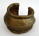 African bangle, 19th century. Bronze. With decorations. H .: 6.5 cm. Dia .: 10,5 cm.
