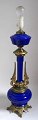 French lamp, 
about 1900, 
of bronze and 
cobolt blue 
glass. With 
Griffins. 
Formerly 
a kerosene ...