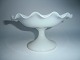 Matte white 
opaline tray 
with wavy edge, 
France approx. 
1880. 
13cm. high, 
23.5cm. wide 
and ...