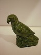 Lille 
sparebøsse i 
grønglaseret 
terrakotta i 
form af en 
papegøje. 
Bornholm før 
1890, ...