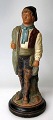 Italian 
ceramics, 19th 
century. A 
fisherman with 
nets. With cold 
paint. On 
circular foot. 
H: 21 ...